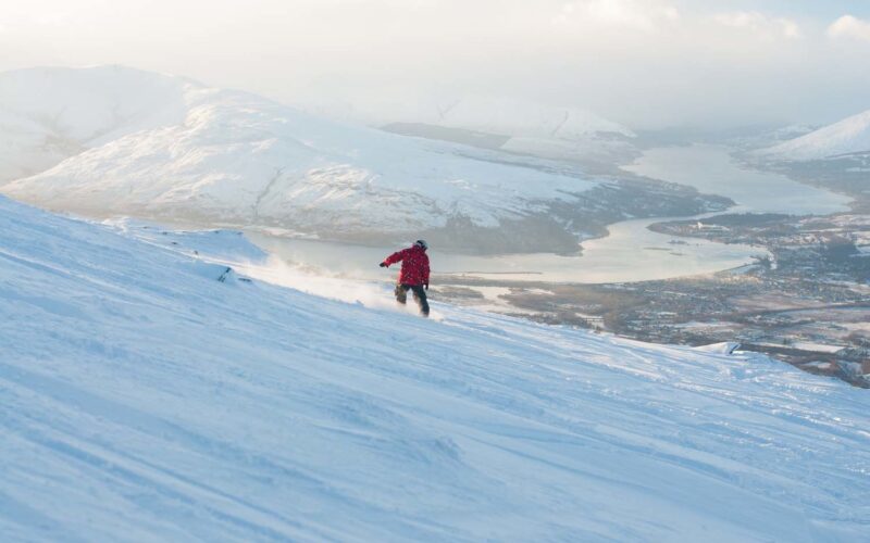 Stuart Kerr Of Glasgow Snowboarding The Nevis Range With Loch Linnhe And Eil Behind